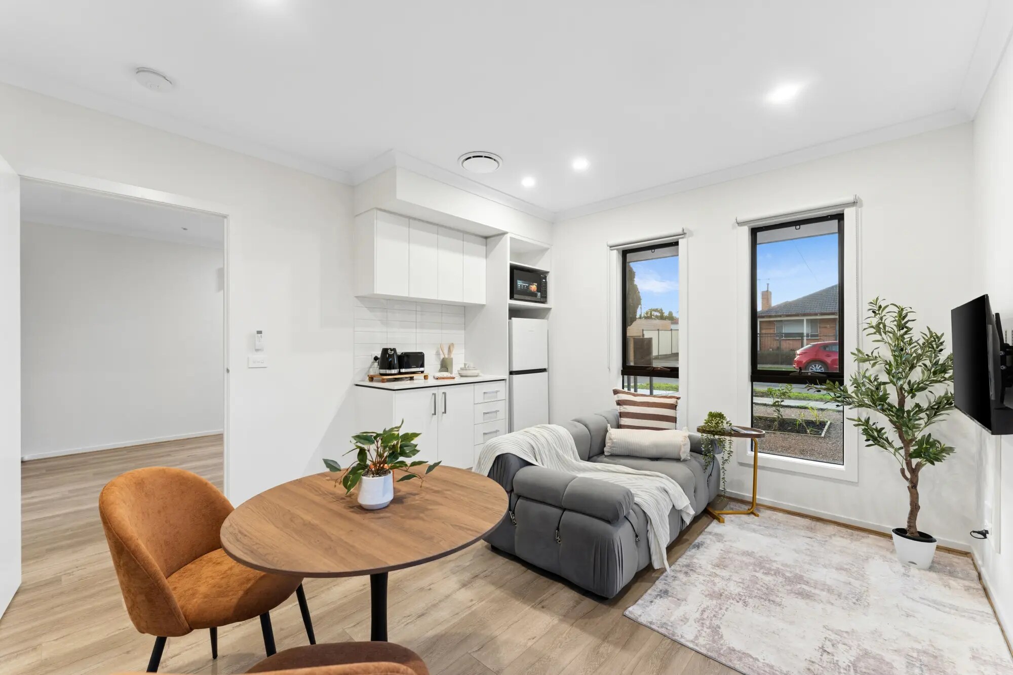 Illustrative studio living area and kitchenette
